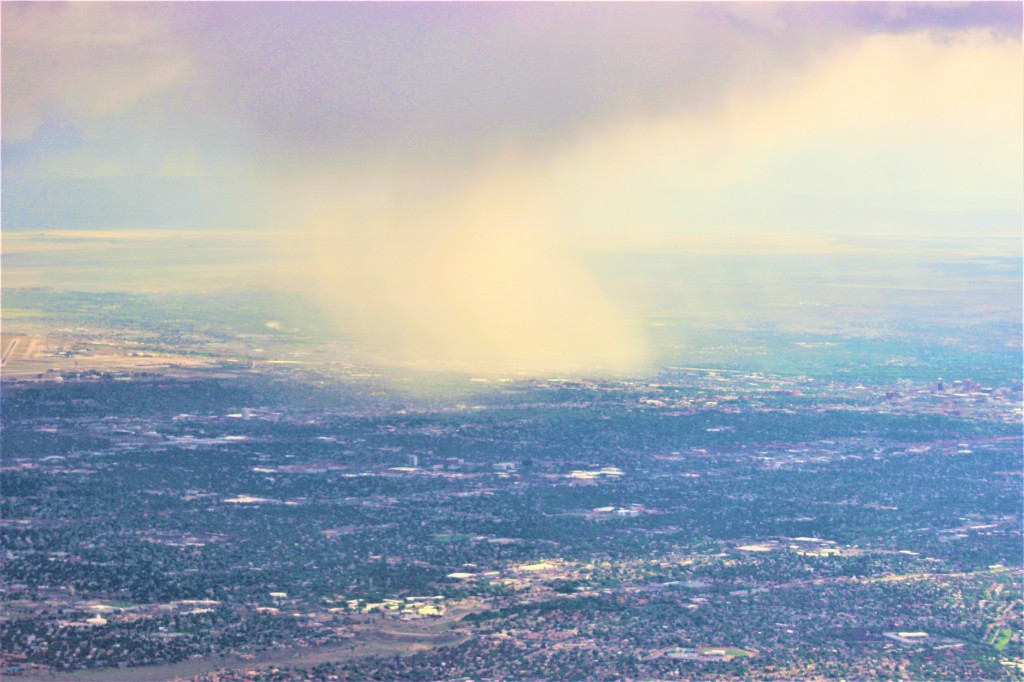 a cloud burst over a portion of the city of Albuquerque seen from Sandia Peak 