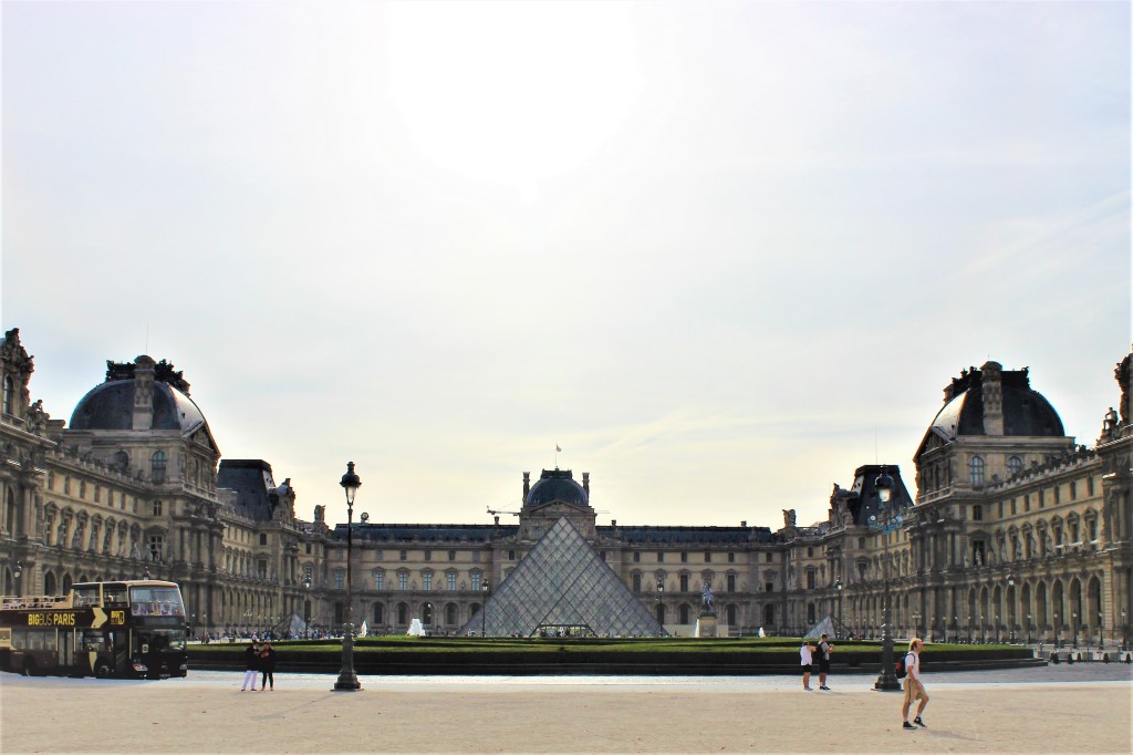 The Louvre Museum with the sun rising in the back